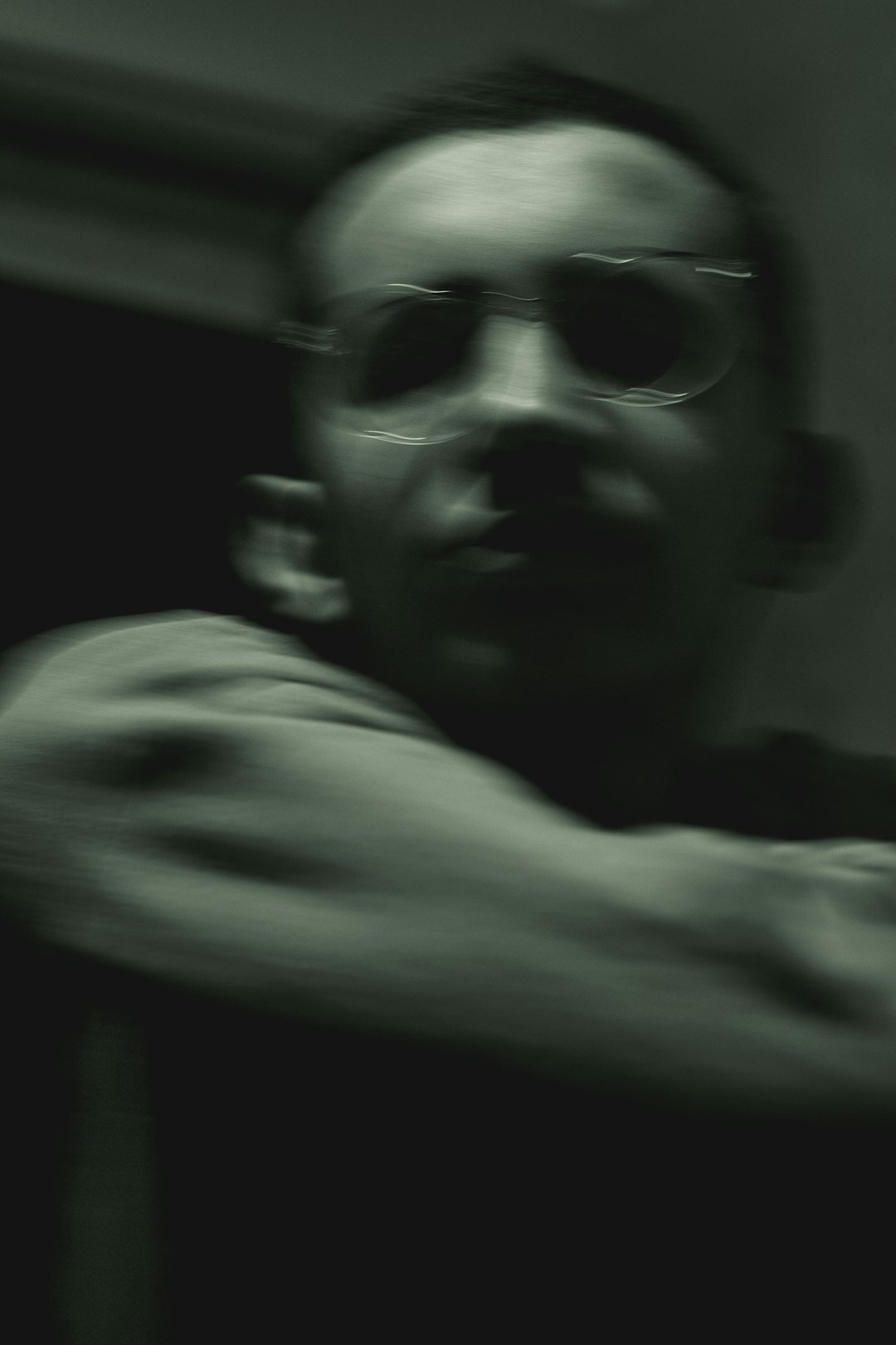 Portrait of a Moroccan-Belgian man wearing glasses
